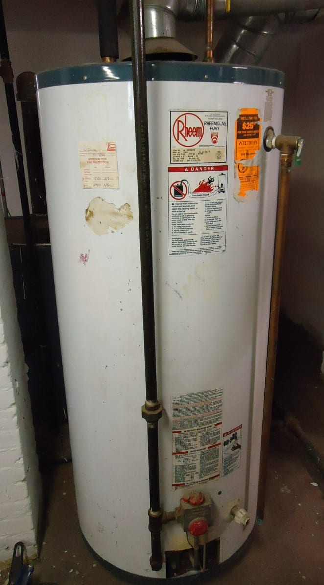 Standing gas water heater with connected piping